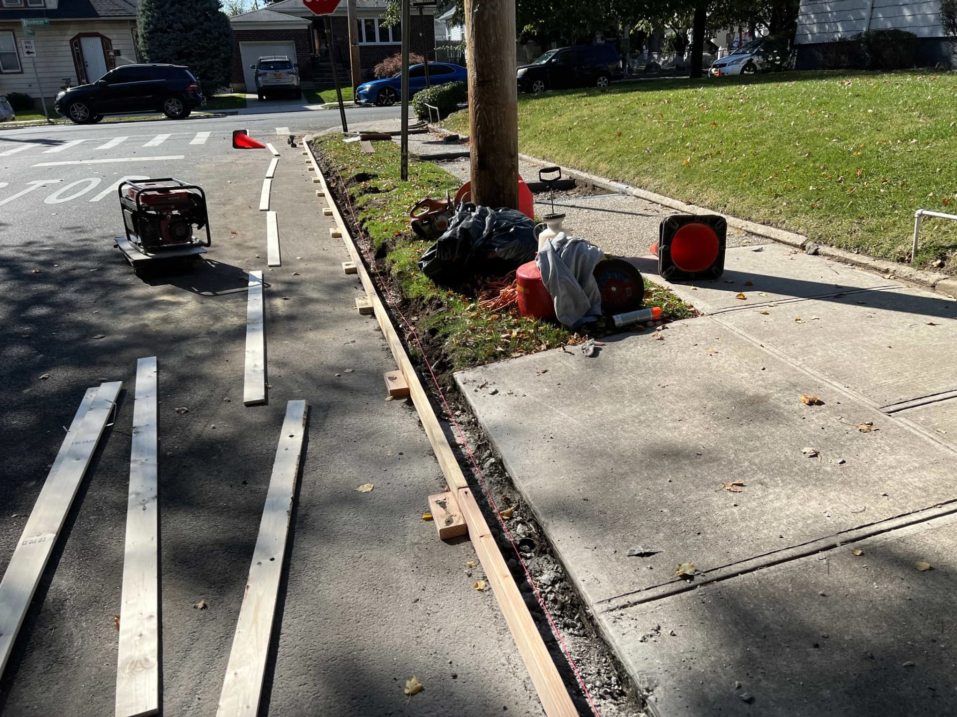 Curb formwork setup for concrete curb installation in NYC