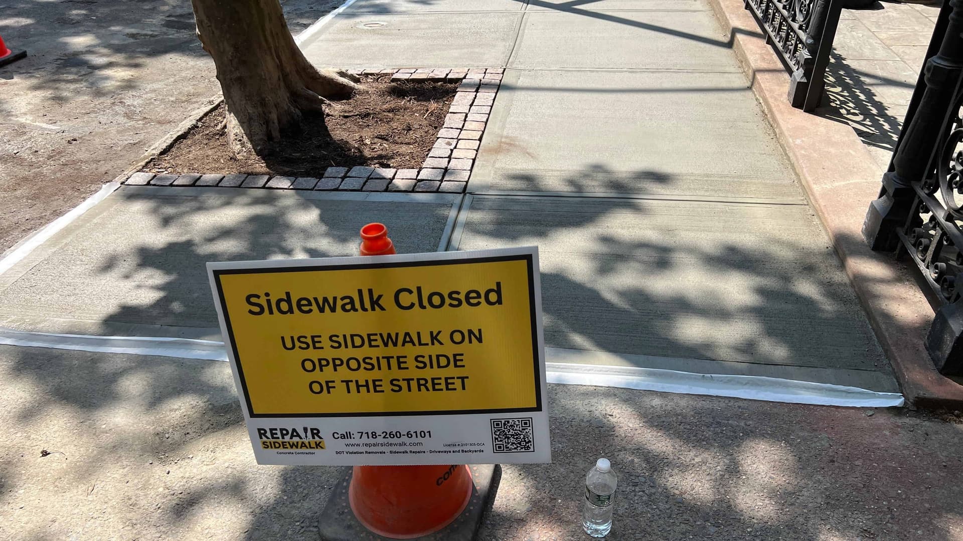 Tree root sidewalk repair warning sign