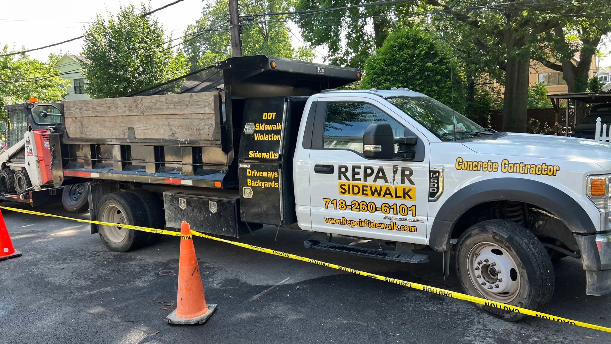 Repair Sidewalk Inc work truck on project site