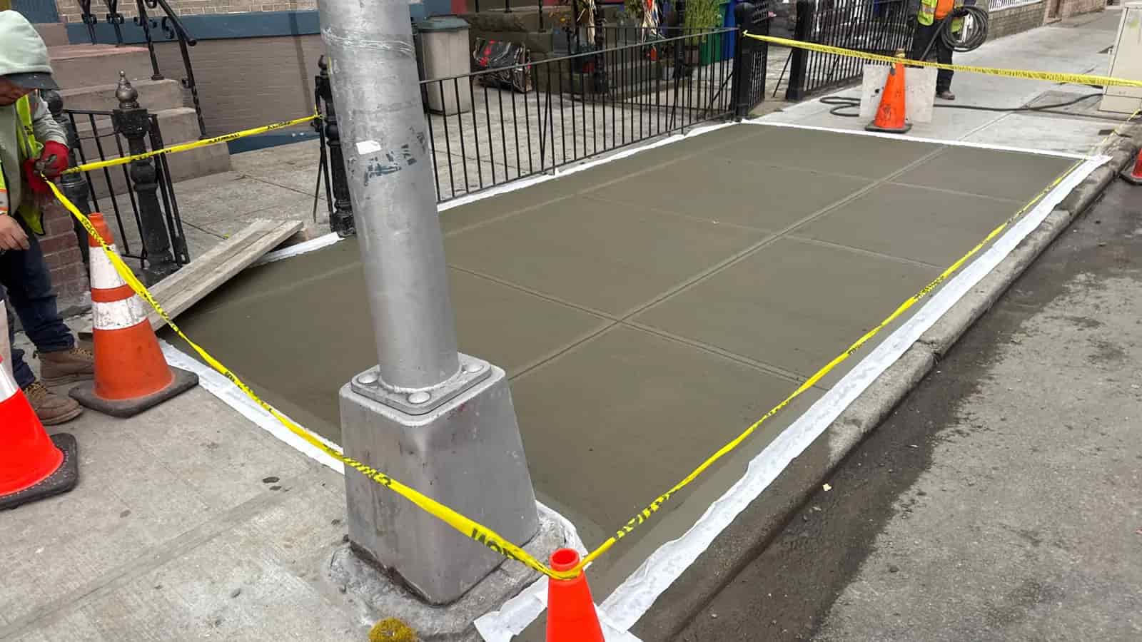 Finished NYC sidewalk slabs after lien repair work