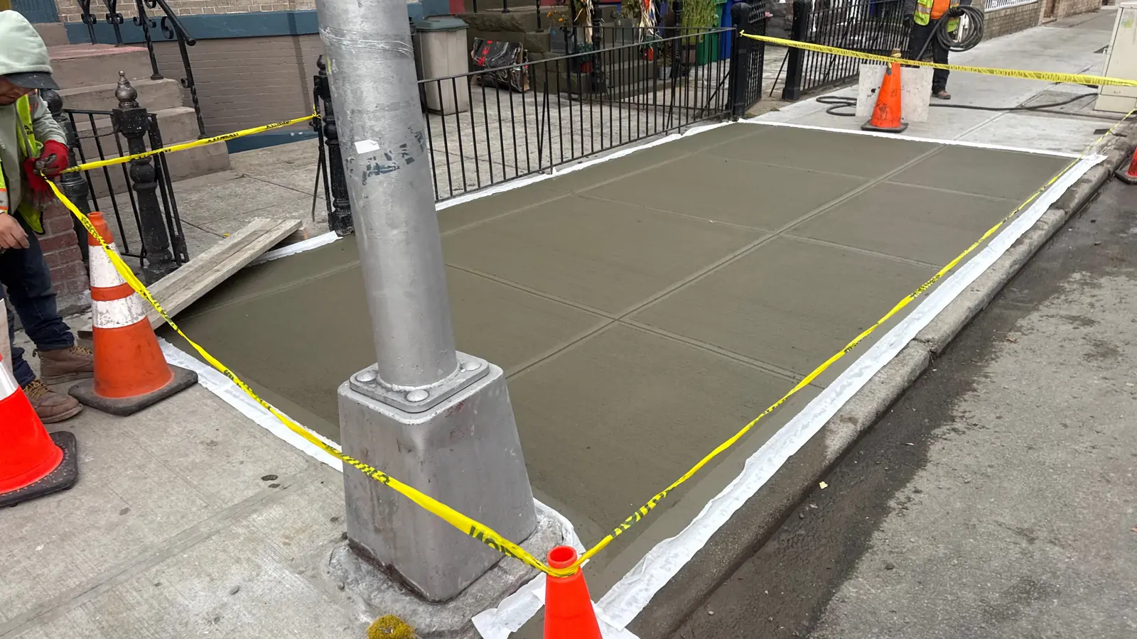 Finished sidewalk slabs after lien-related repair service