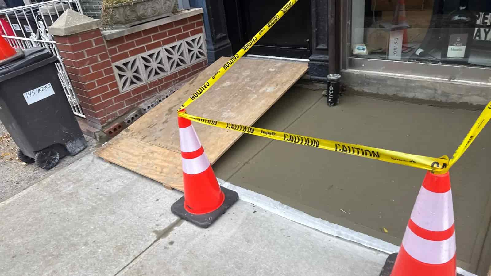 NYC driveway curb and sidewalk area restored with fresh concrete
