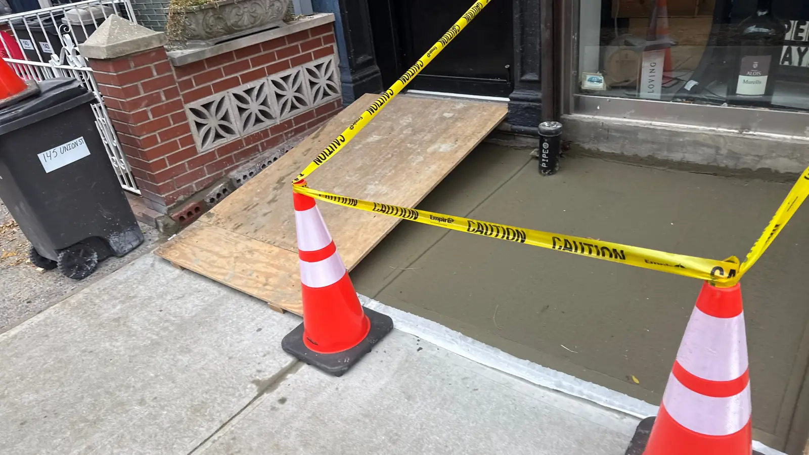 Fresh concrete entry sidewalk repair and curb restoration in NYC